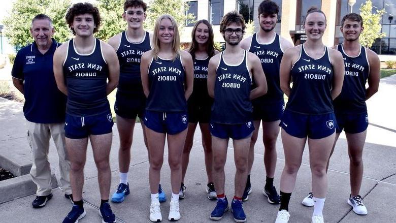 2023 Penn State DuBois Cross Country Team, men and women standing in front of the PAW Center building