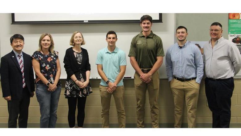 Penn State DuBois students, faculty, 实习报告结束后，员工和客人聚在一起合影留念. From left to right; John Kness, Ethan Kness, Grant Grimaldi, Carter Lindemuth, Lorna Hardin, Leanne Nedza and Jungwoo Ryoo.